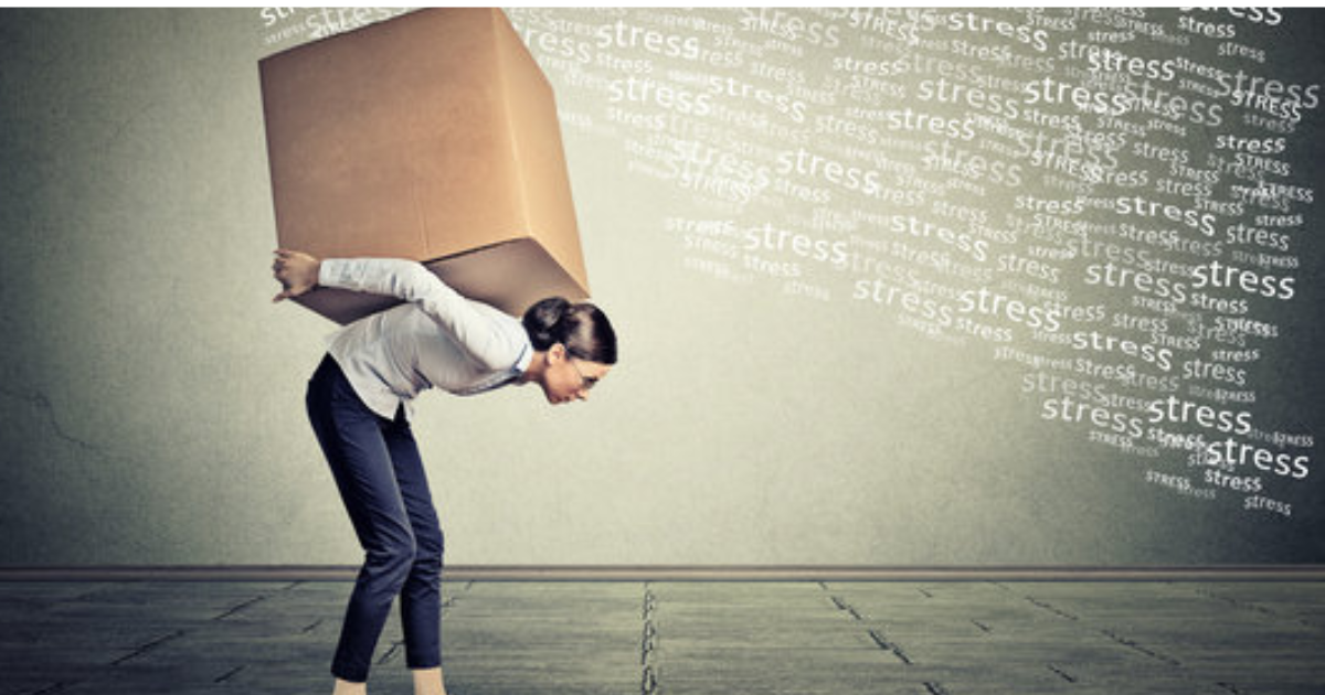 Woman carrying heavy stress load — why high achievers carry emotional weight without realising it